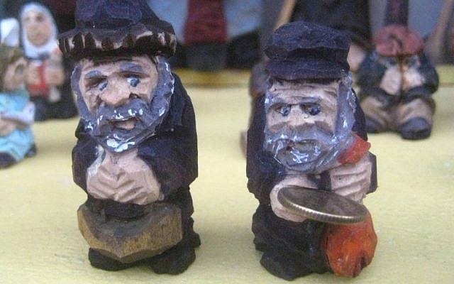 Ryszard Kucharski's carved Lucky Jew miniatures on display in Warsaw (photo credit: Ilan Ben Zion/Times of Israel staff)