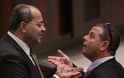 MK Ahmad Tibi of the Ra'am Ta'al party (L) and Labor MK Eitan Cabel at the Knesset on December 3, 2014 (photo credit: Courtesy)