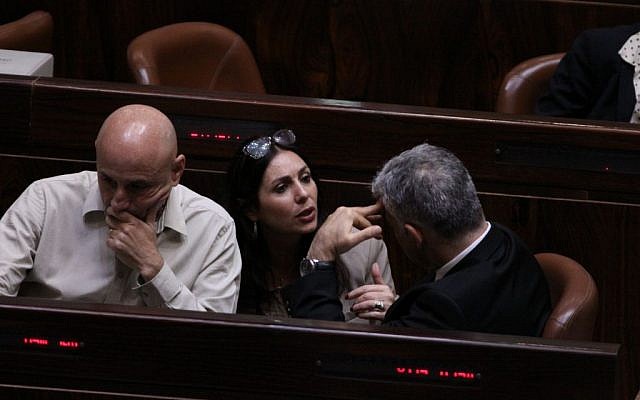 Likud MK Miri Regev (C) speaks to Yesh Atid MK Yair Lapid (R) at the Knesset on December 3, 2014. (photo credit: Courtesy)