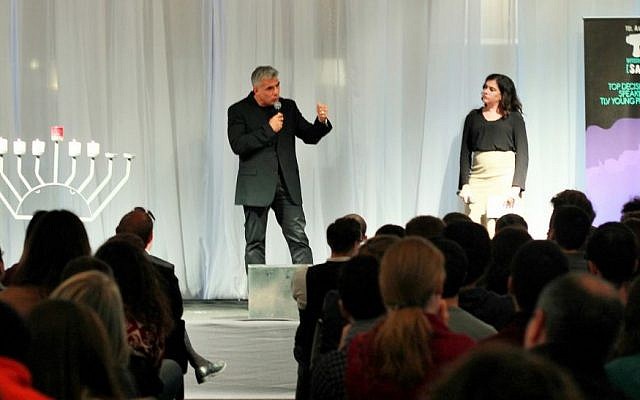 Yair Lapid of the Yesh Atid party speaks with Tel Aviv International Salon host Natalie Solomon and about 300 young English-speaking olim in Tel Aviv, December 21, 2014. (Courtesy Deborah Danan) Yair Lapid of the Yesh Atid party speaks with Tel Aviv International Salon host Natalie Solomon and about 300 young English-speaking olim in Tel Aviv, December 21, 2014. (Courtesy Deborah Danan)