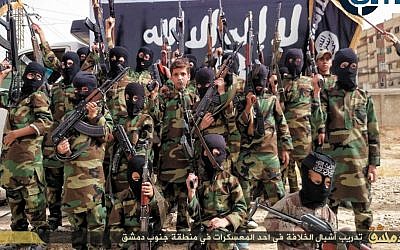 "Cubs of the Caliphate." Children pose for a photograph in a training camp near Damascus, Syria, December 6, 2014. (photo credit: SITE Intel Group) 