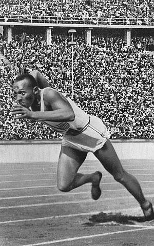 Jesse Owens starts the 200 meters sprint at the 1936 Berlin Olympics photo credit: Wikipedia)