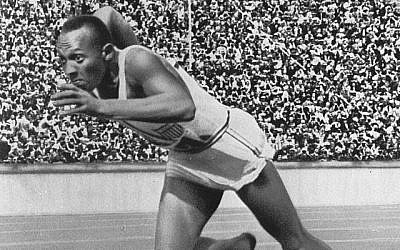 Jesse Owens starts the 200 meters sprint at the 1936 Berlin Olympics photo credit: Wikipedia)