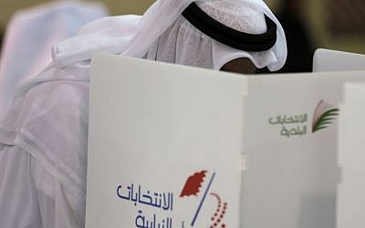 A Bahraini man votes in Manama, Bahrain, Saturday, Nov. 29, 2014. Bahraini voters are returning to the polls Saturday for a runoff election being boycotted by the opposition for the country's first new parliament since widespread Arab Spring-inspired protests nearly four years ago. (photo credit: AP/Hasan Jamali)