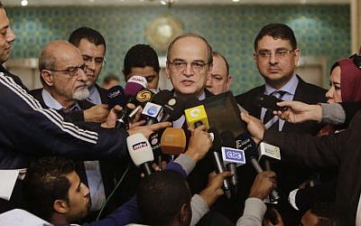 Hadi Bahra (C), the head of the Syrian National Coalition, the country's main political opposition group, speaks during a press conference in Cairo, Egypt, Saturday, Dec. 27, 2014. (photo credit: AP/Amr Nabil)