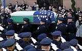 Pallbearers carry the casket of New York City police officer Rafael Ramos following funeral services at Christ Tabernacle Church, in the Glendale section of Queens, Saturday, Dec. 27, 2014, in New York. Ramos and his partner, officer Wenjian Liu, were killed Dec. 20 as they sat in their patrol car on a Brooklyn street. The shooter, Ismaaiyl Brinsley, later killed himself. (photo credit: AP Photo/Julio Cortez)