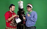 Jews decorate a Christmas tree in Buzzfeed video. (YouTube screenshot)