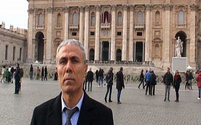 Ali Agca stands in front of St. Peter's Basilica at the Vatican, Saturday, Dec. 27, 2014. The Turkish gunman who shot and wounded John Paul II in 1981 laid white flowers Saturday on the saint's tomb in St. Peter's Basilica (photo credit: AP/Adnkronos International, ho)