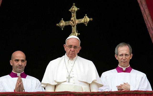 Pope Francis, center, delivers his "Urbi et Orbi" (to the city and to the world) blessing from the central balcony of St. Peter's Basilica at the Vatican, Thursday, December 25, 2014. (AP Photo/Alessandra Tarantino) Pope Francis, center, delivers his "Urbi et Orbi" (to the city and to the world) blessing from the central balcony of St. Peter's Basilica at the Vatican, Thursday, December 25, 2014. (AP Photo/Alessandra Tarantino)