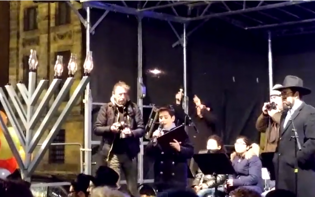 Illustrative: A boy sings at a Hanukkah candle lighting ceremony in Amsterdam on December 18, 2014. (screen capture: YouTube) Illustrative: A boy sings at a Hanukkah candle lighting ceremony in Amsterdam on December 18, 2014. (screen capture: YouTube)