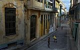 Children playing a baseball game in the streets of Havana. (Joe Raedle/Getty Images/ via JTA)