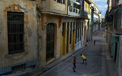 Children playing a baseball game in the streets of Havana. (Joe Raedle/Getty Images/ via JTA)