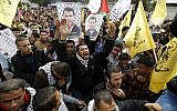 Palestinian supporters of dismissed senior Fatah leader Mohammed Dahlan shout slogans during a protest in Gaza City on December 18, 2014. (AFP/Mohammed Abed)