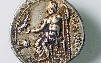 An image of Zeus and the inscription bearing the name of Alexander. (photo credit: Robert Kool, courtesy of the Israel Antiquities Authority) An image of Zeus and the inscription bearing the name of Alexander. (photo credit: Robert Kool, courtesy of the Israel Antiquities Authority)