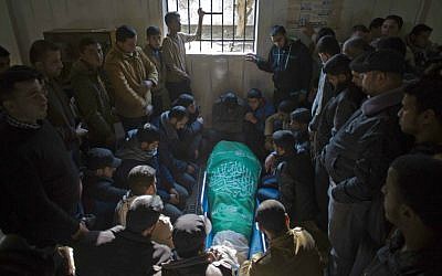 The December 24, 2014 Gaza funeral of Tayseir Smeiry, a Hamas operative, who was killed by Israeli troops after gunmen from Gaza opened fire on an IDF force within Israel (photo credit: AP Photo/ Khalil Hamra)