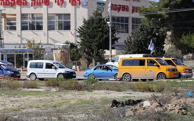 The woman who stabbed and lightly injured an Israeli man at the West Bank Gush Etzion junction, south of Jerusalem, seen laying on the ground after being shot by Israeli security forces on December 01, 2014. (Photo credit: Gershon Elinson/FLASH90)