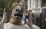 Illustrative photo of a horse-head mask (screen capture: YouTube)