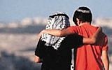 A photo of a Jewish and a 'Palestinian' boy overlooking Jerusalem and embracing each other, 1993. The picture was later uncovered to be a farce. (screen capture: YouTube)