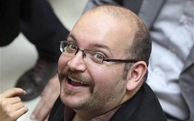 Jason Rezaian, an Iranian-American correspondent for the Washington Post, at a campaign event for President Hassan Rouhani in Tehran, Iran, April 13, 2013 (photo credit: AP/Vahid Salemi) Jason Rezaian, an Iranian-American correspondent for the Washington Post, at a campaign event for President Hassan Rouhani in Tehran, Iran, April 13, 2013 (photo credit: AP/Vahid Salemi)