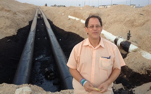 Yosef Abramowitz stands in front of the damaged portion of the Trans-Israel pipeline (Photo credit: Courtesy) Yosef Abramowitz stands in front of the damaged portion of the Trans-Israel pipeline (Photo credit: Courtesy)