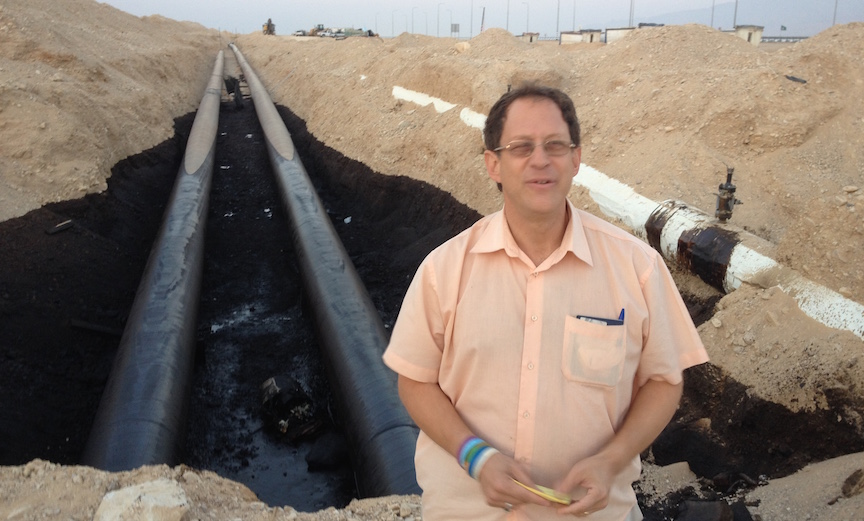Yosef Abramowitz stands in front of the damaged portion of the Trans-Israel pipeline (Photo credit: Courtesy) Yosef Abramowitz stands in front of the damaged portion of the Trans-Israel pipeline (Photo credit: Courtesy)