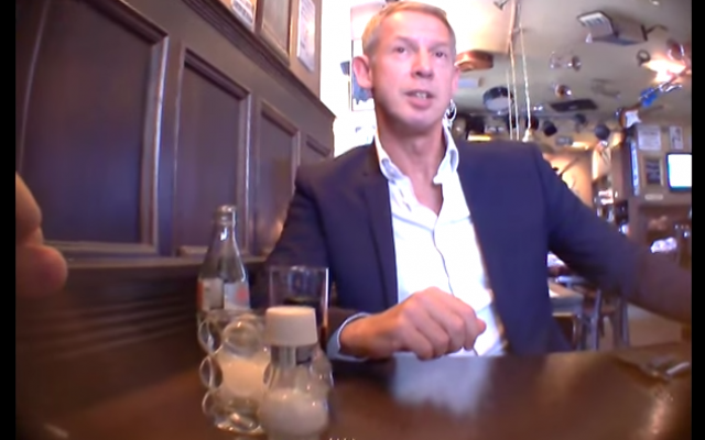A screen capture of hidden camera footage of Dutch politician Onno Hoes during an outing with a younger man. (screen capture: YouTube)