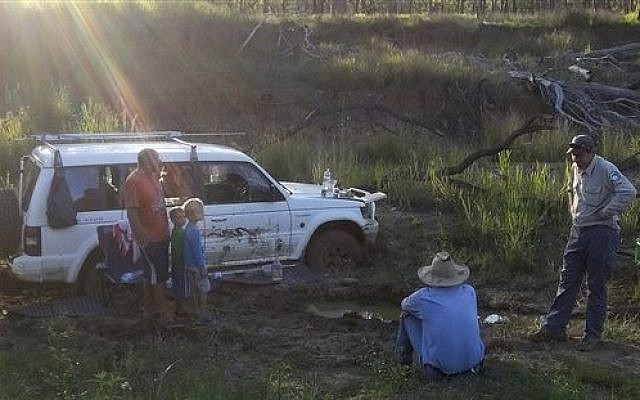 In this Dec 22, 2014, Steven Van Lonkhuyzen, left, with his sons Timothy, 5, second left, and Ethan, 7, third left, speaks to farmer Tom Wagner, center, and a park ranger in the remote Expedition National Park, northwest of Brisbane in Australia where they were found after 10 days. (AP Photo/Queensland Police) In this Dec 22, 2014, Steven Van Lonkhuyzen, left, with his sons Timothy, 5, second left, and Ethan, 7, third left, speaks to farmer Tom Wagner, center, and a park ranger in the remote Expedition National Park, northwest of Brisbane in Australia where they were found after 10 days. (AP Photo/Queensland Police)