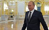 Russian President Vladimir Putin arrives to deliver his annual address at the Kremlin in Moscow on December 4, 2014 (photo credit: AFP/Ria-Novosti/Pool/Alexei Druzhinin)