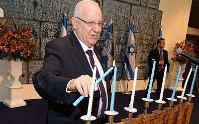 President Rivlin during a Hanukkah candle-lighting ceremony with Holocaust survivors at his residence in Jerusalem, December 22, 2014. (photo credit: Mark Neyman/GPO/Flash90) President Rivlin during a Hanukkah candle-lighting ceremony with Holocaust survivors at his residence in Jerusalem, December 22, 2014. (Mark Neyman/GPO/Flash90)