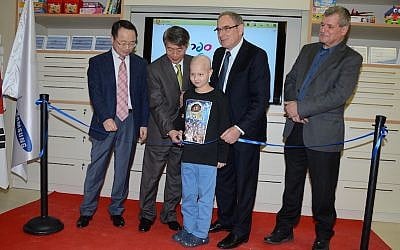 (L to R) Samsung Israel CEO Karyen Kai; South Korean ambassador to Israel Lee Gun-Tae; Or Wilhelm, a nine year old oncology patient at Schneider Children's Hospital; Professor Yosef Peres of Schneider Children's Hospital; and MK Miki Rosenthal (Photo credit: Aviv Hofi)
