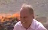 The BBC's Middle East Correspondent Quentin Sommerville in a fit of hysterics near a pile of burning narcotics. (Screenshot: YouTube)