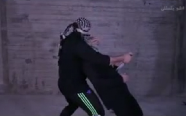 A screenshot of a Hamas instructional video on proper stabbing techniques. (screen shot: YouTube) A screenshot of a Hamas instructional video on proper stabbing techniques. (screen shot: YouTube)