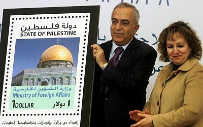 Former Palestinian prime minister Salam Fayyad participated in the unveiling of the first postage stamp bearing the name of the State of Palestine on January 28, 2013. (photo credit: Issam Rimawi/Flash90)