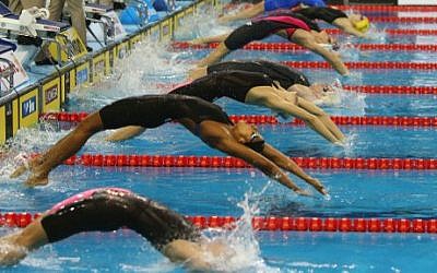 Illustrative photo of swimmers competing in the Women's 50m Backstroke semi-finals during the 12th FINA World Swimming Championships in Doha, December 6, 2014 (photo credit: AFP PHOTO/Marwan Naamani)