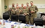 Troops with their Hannukah care packages. (Photo credit: Ava Hamburger/courtesy )
