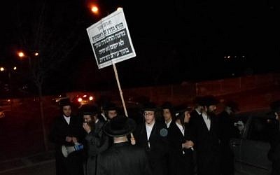 Protesters last Thursday outside the home of Rabbi Menachem Bombach, head of the Boys Hassidic Midrasha, which teaches both secular and religious subjects (Courtesy: Menachem Bombach)