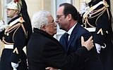French President Francois Hollande welcomes Palestinian Authority President Mahmoud Abbas at the Elysee Palace before attending a unity rally “Marche Republicaine” on January 11, 2015 in Paris in tribute to the 17 victims of a three-day killing spree by homegrown Islamists. (AFP/ Dominique Faget)