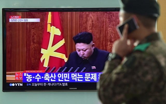 A South Korean soldier talks over his phone in front of a television screen showing North Korean leader Kim Jong-Un's New Year speech, at a railroad station in Seoul on January 1, 2015. (photo credit: AFP PHOTO / JUNG YEON-JE) A South Korean soldier talks over his phone in front of a television screen showing North Korean leader Kim Jong-Un's New Year speech, at a railroad station in Seoul on January 1, 2015. (photo credit: AFP PHOTO / JUNG YEON-JE)