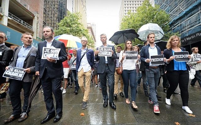 French ambassador to Australia Christophe Lecourtier (2nd L) leads members of Sydney's French community in the heart of the city to pay tribute to the Paris jihadist attack victims, near the scene of a deadly cafe siege last month in Sydney, on January 11, 2015. (photo credit: AFP PHOTO/Peter PARKS) French ambassador to Australia Christophe Lecourtier (2nd L) leads members of Sydney's French community in the heart of the city to pay tribute to the Paris jihadist attack victims, near the scene of a deadly cafe siege last month in Sydney, on January 11, 2015. (photo credit: AFP PHOTO/Peter PARKS)