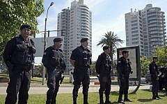 Illustrative photo of security forces standing guard near the World Trade Center Montevideo, which houses offices of the Israeli embassy, on January 8, 2015 (AFP/Mario Goldman)