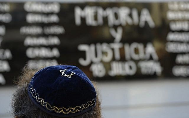 A Jewish man rallies in front of the headquarters of the AMIA (Argentine Israelite Mutual Association), in Buenos Aires on January 21, 2015. (photo credit: AFP PHOTO / Alejandro PAGNI) A Jewish man rallies in front of the headquarters of the AMIA (Argentine Israelite Mutual Association), in Buenos Aires on January 21, 2015. (photo credit: AFP PHOTO / Alejandro PAGNI)