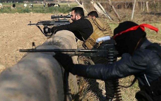 Pro-Iraqi government fighters take part in an operation to secure an area they seized from the Islamic State (IS) militants, December 29, 2014. (photo credit: AFP/ MOHAMMED SAWAF) Pro-Iraqi government fighters take part in an operation to secure an area they seized from the Islamic State (IS) militants, December 29, 2014. (photo credit: AFP/ MOHAMMED SAWAF)