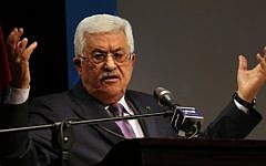 Palestinian Authority President Mahmoud Abbas gestures during a speech in the West Bank city of Ramallah on January 4, 2015. (photo credit: AFP/Abbas Momani)