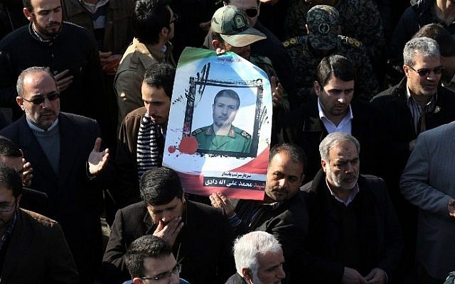 Illustrative: Iranian mourners carry a portrait of Brigadier General Mohammad Ali Allahdadi, a commander of the Islamic republic's Revolutionary Guards killed in a reported Israeli air strike on Syria, during his funeral procession in Tehran on January 21, 2015. ( AFP/ATTA KENARE) Illustrative: Iranian mourners carry a portrait of Brigadier General Mohammad Ali Allahdadi, a commander of the Islamic republic's Revolutionary Guards killed in a reported Israeli air strike on Syria, during his funeral procession in Tehran on January 21, 2015. ( AFP/ATTA KENARE)