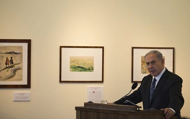 Prime Minister Benjamin Netanyahu speaks at the opening of a new exhibition in the Yad Vashem Museum of Holocaust Art in Jerusalem, to mark the International Holocaust Remembrance Day and the 70th anniversary of the liberation of the former Nazi German concentration and extermination camp Auschwitz-Birkenau on January 27, 2015. (Photo credit: AFP/ POOL / RONEN ZVULUN) Prime Minister Benjamin Netanyahu speaks at the opening of a new exhibition in the Yad Vashem Museum of Holocaust Art in Jerusalem, to mark the International Holocaust Remembrance Day and the 70th anniversary of the liberation of the former Nazi German concentration and extermination camp Auschwitz-Birkenau on January 27, 2015. (Photo credit: AFP/ POOL / RONEN ZVULUN)