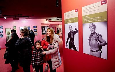 A picture taken on December 20, 2014 in Istanbul shows people visiting the "Here I am, Zeki Muren" exhibition. (photo credit: AFP/OZAN KOSE)