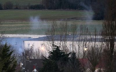 Smoke rises from a building in Dammartin-en-Goele, north-east of Paris, where two brothers suspected of slaughtering 12 people in an Islamist attack on French satirical newspaper Charlie Hebdo held one person hostage as police cornered the gunmen on January 9, 2015. (Photo credit: AFP/ JOEL SAGET) 