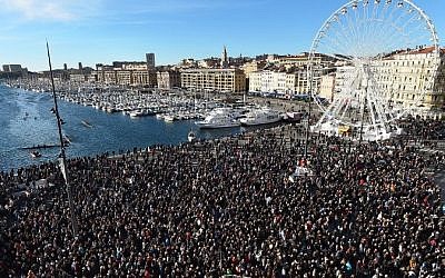People march during a demonstration attended by an estimated 45.000 on the old harbour in Marseille, southern France on January 10, 2015. (Photo credit: AFP/ ANNE-CHRISTINE POUJOULAT)