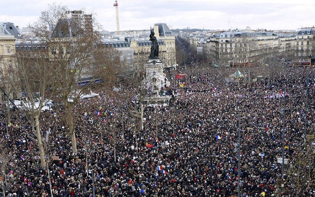 People gather on the Place de la Republique in Paris before the start of a Unity rally on January 11, 2015, in tribute to the 17 victims of a three-day killing spree by Islamic fundamentalists. (AFP/Bertrand Guay)