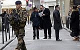 A French soldier patrols in the Jewish quarter of the Marais district, Paris, January 12, 2015. photo credit: AFP/Bertrand Guay)